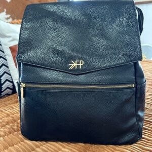 Freshly picked diaper bag with changing pad.